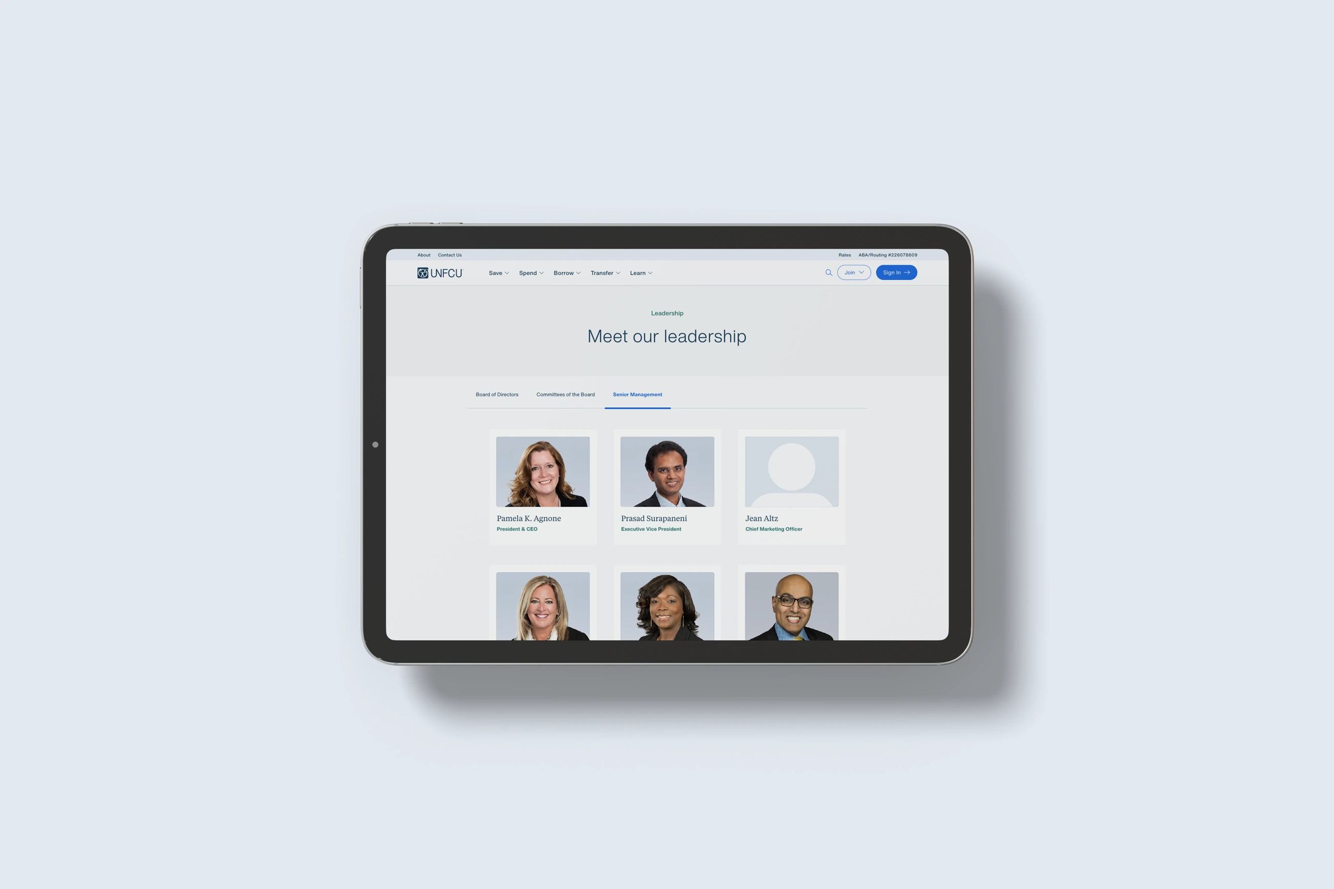 Earlier UNFCU leadership website with inconsistent backgrounds and portrait crops