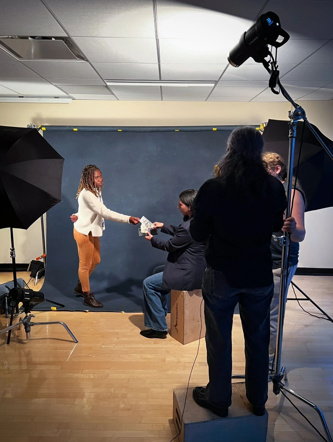 Studio crew and lighting during the UNFCU leadership portrait shoot